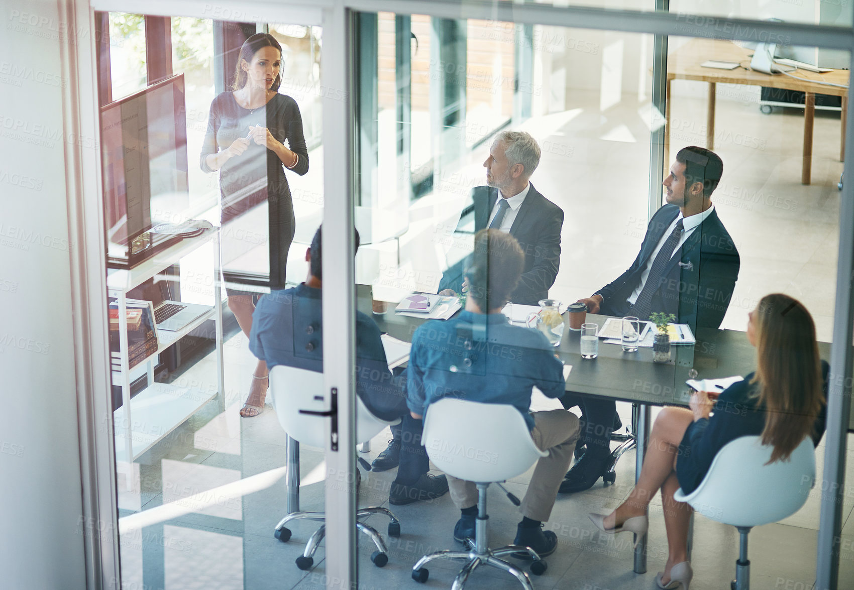 Buy stock photo High angle shot of a pregnant businesswoman giving a presentation in the boardroom