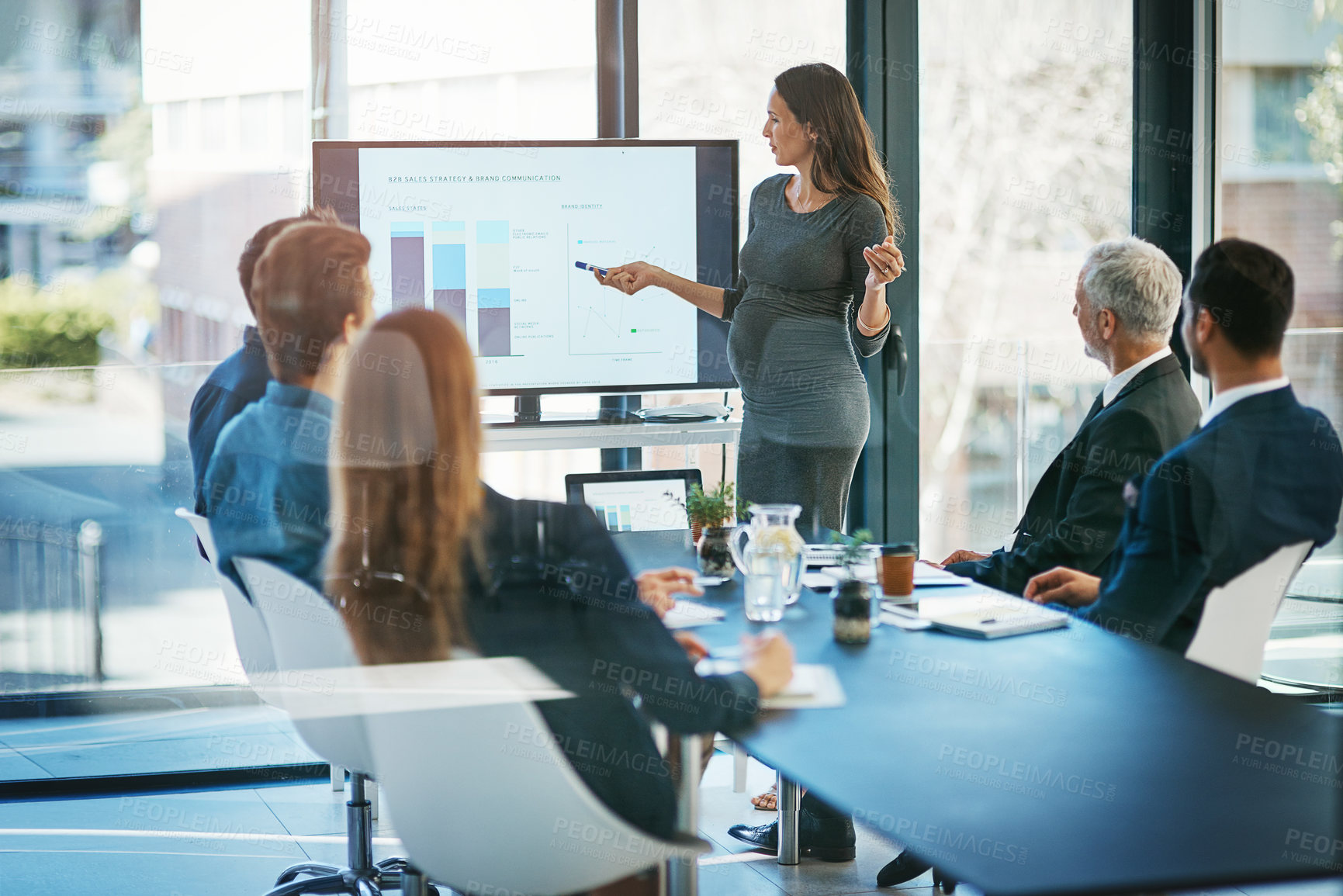 Buy stock photo Pregnant, business woman and sale presentation at a teamwork workshop with speech and communication. Manager, female speaker pregnancy and company learning with staff and boss with graph in office