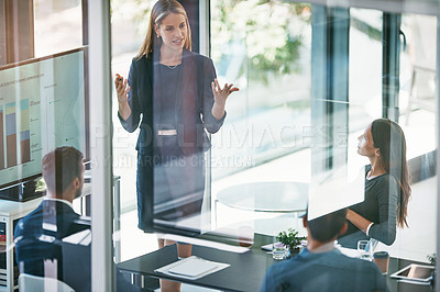 Buy stock photo High angle shot of a young businesswoman giving a presentation in the boardroom