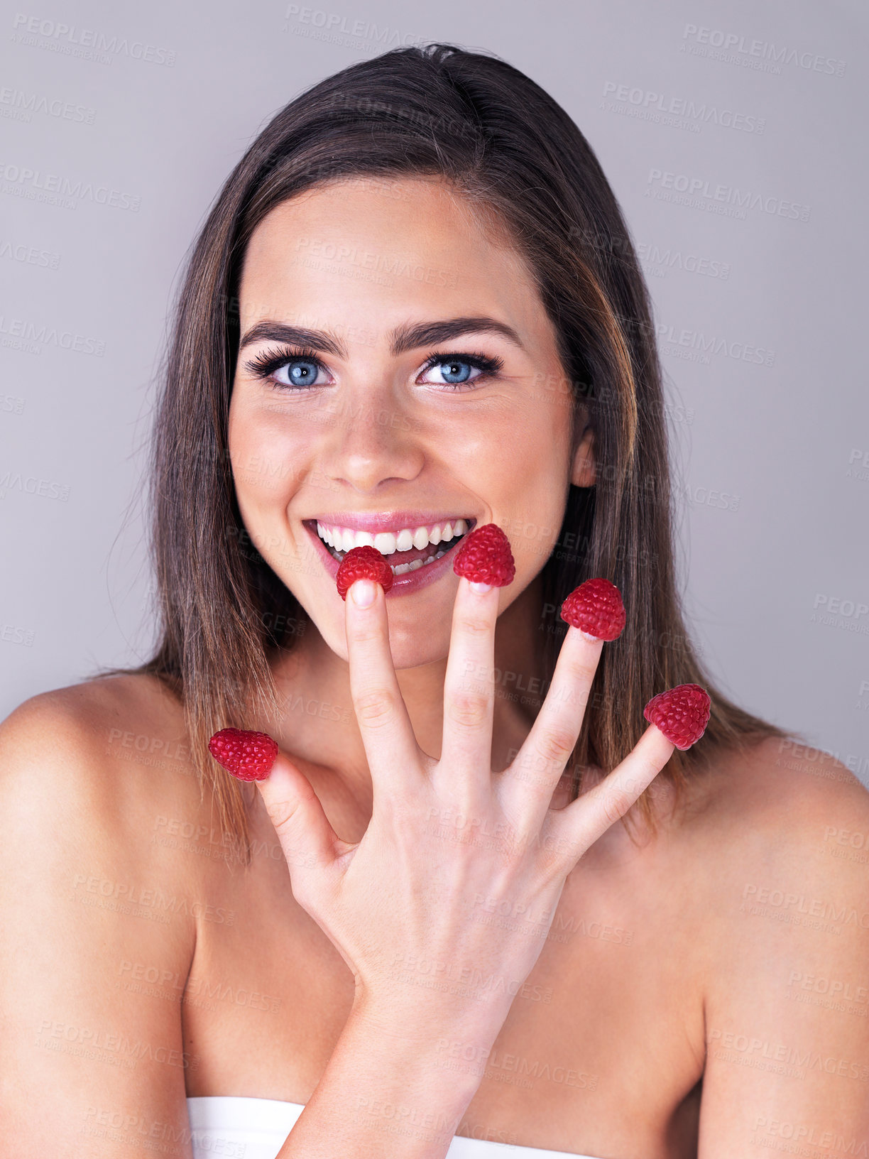 Buy stock photo Woman, portrait and raspberry skincare in studio, organic beauty and fingers on white background. Female person, fruit and vegan cosmetics product for smooth skin, dermatology and sustainable diet