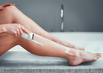 Buy stock photo Legs, shaving razor and woman in home bathroom for hair removal, epilation and self care. Female person with hand for skincare, cleaning body and grooming with foam or soap for health and wellness