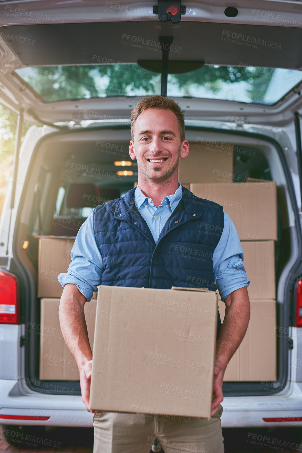 Buy stock photo Portrait of a courier standing alongside his delivery van