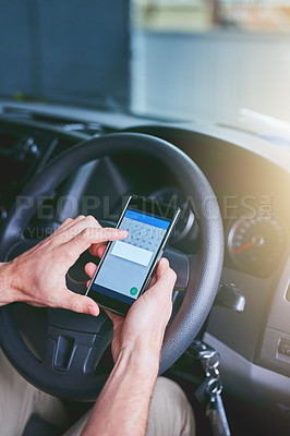 Buy stock photo Shot of a man using his mobile phone while driving