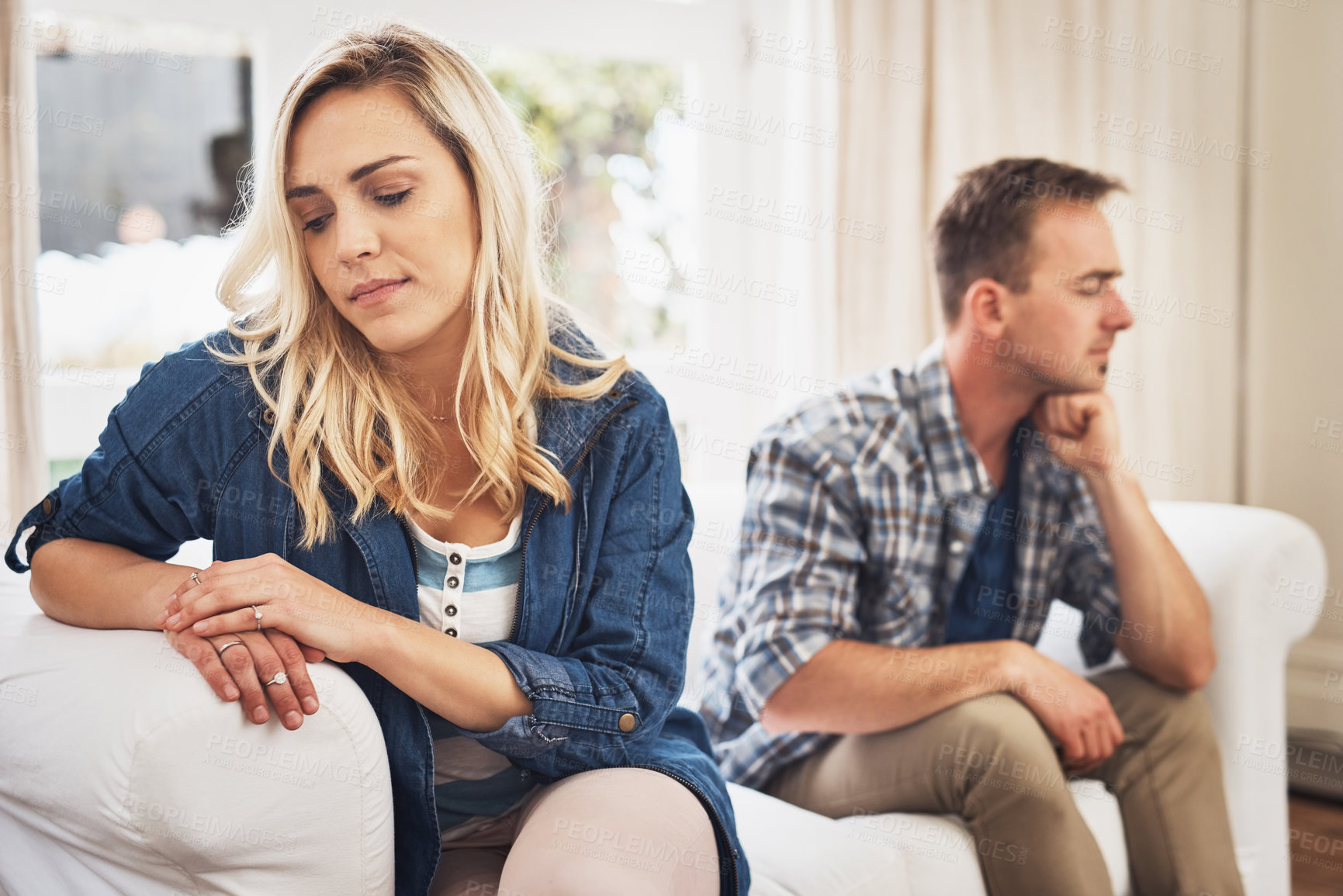 Buy stock photo Shot of a young couple having relationship problems at home