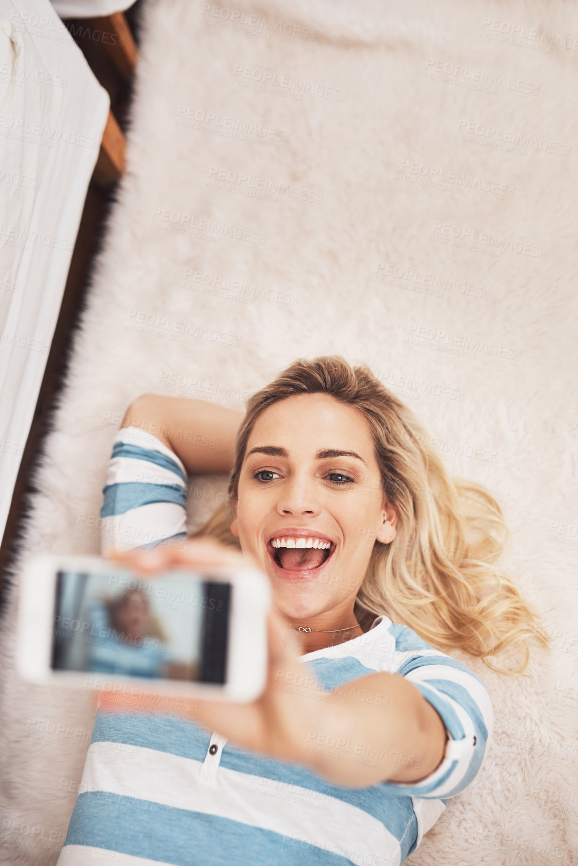 Buy stock photo Above, happy or woman on floor for selfie, live stream or connectivity at home. Excited, influencer or recording in living room for announcement, reveal or online review for followers on social media