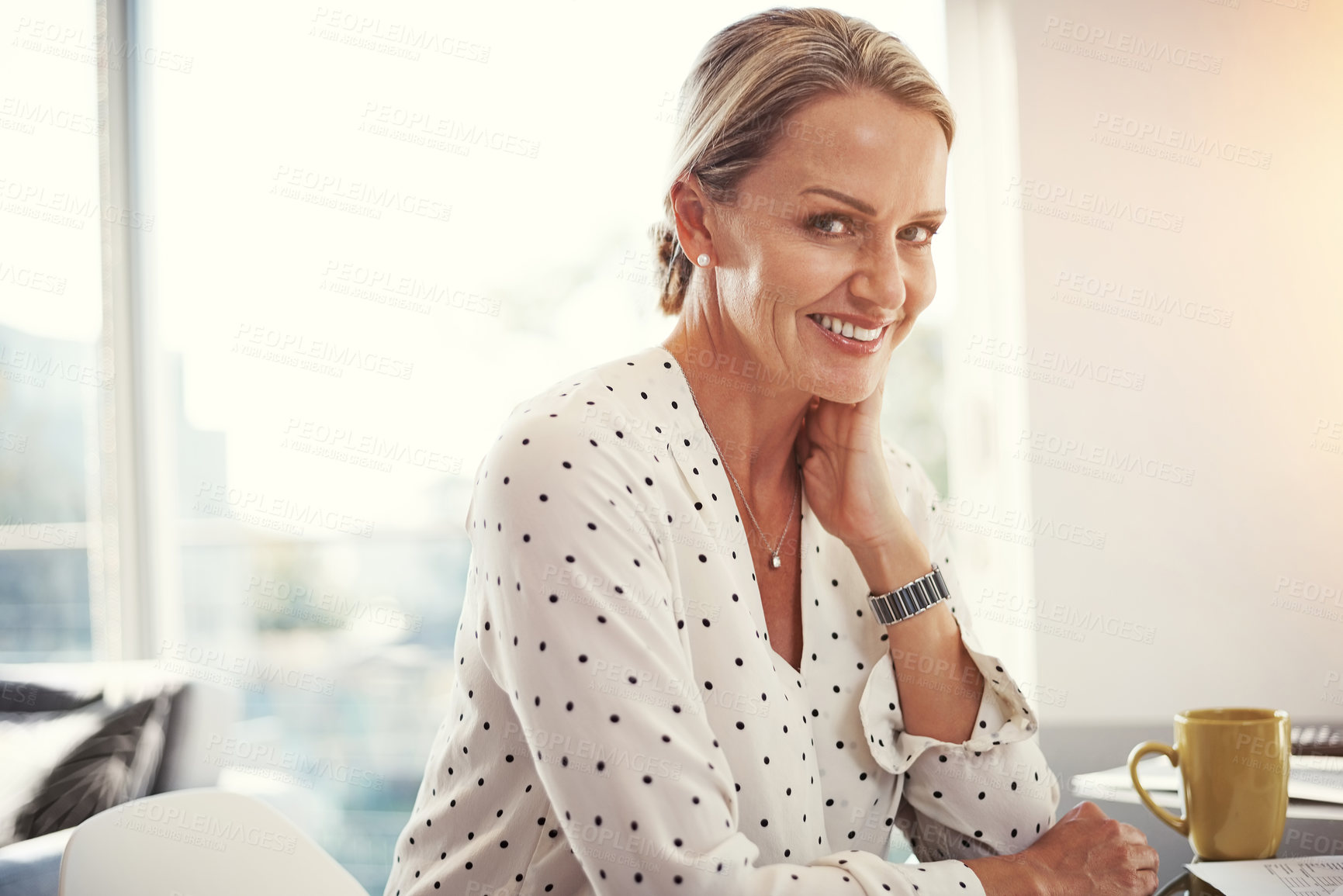 Buy stock photo Cropped shot of a mature businesswoman working from her home office