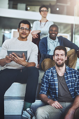 Buy stock photo Portrait of a group of designers sitting on the staircase in an office