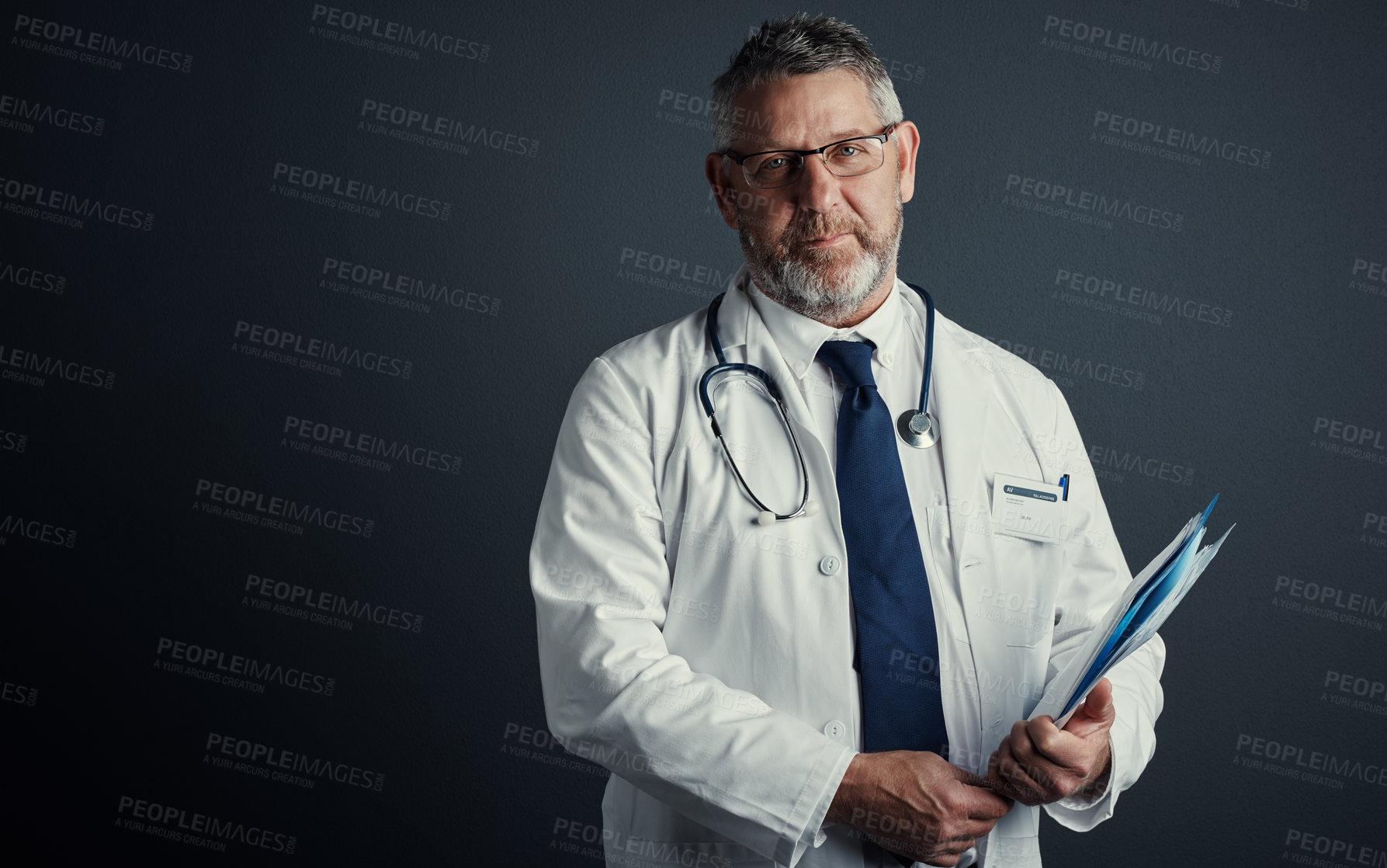 Buy stock photo Mature doctor, man and report in studio portrait with glasses, mockup space and admin on dark background. Person, medical professional and happy with documents, healthcare and folder in Australia