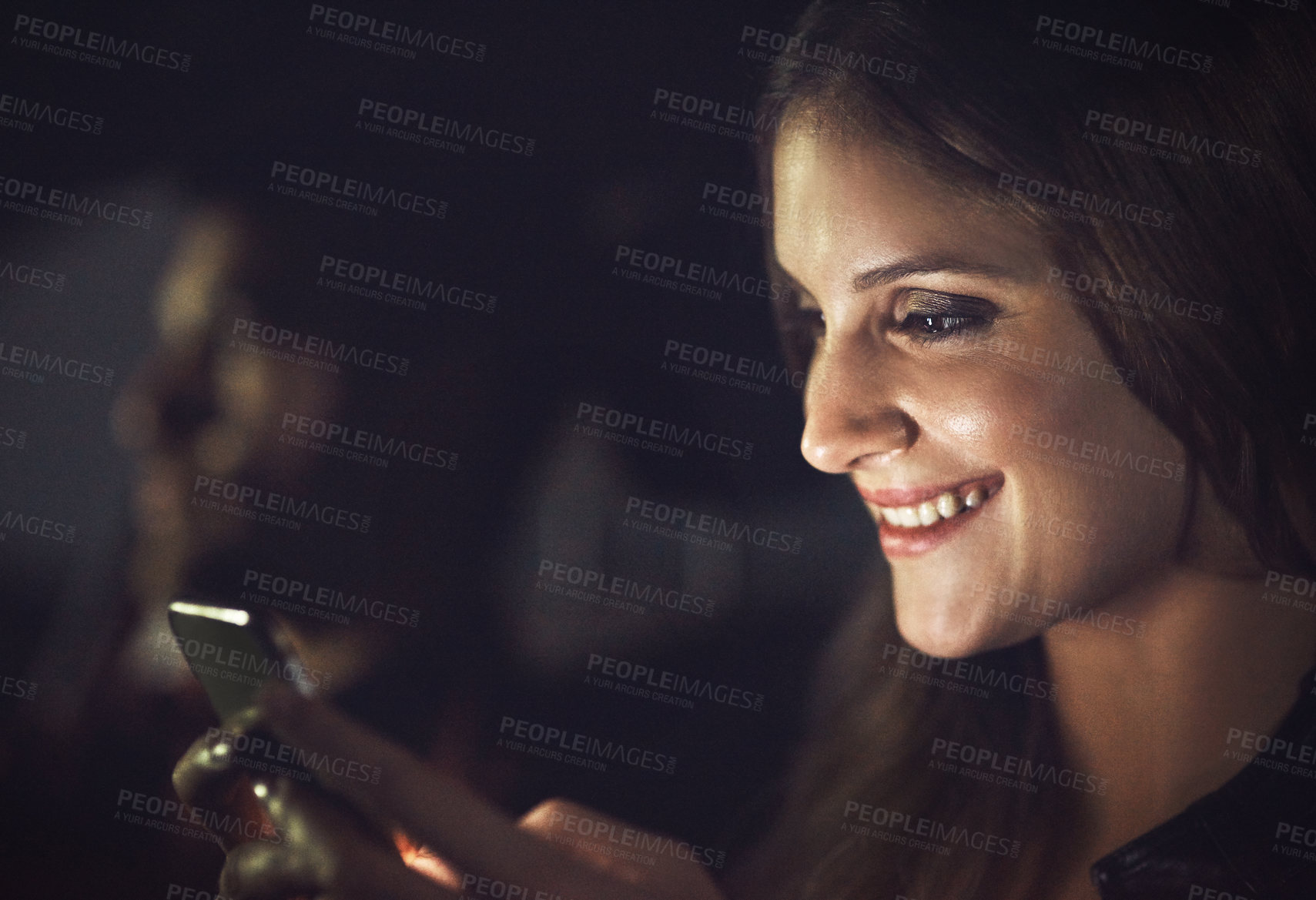 Buy stock photo Cropped shot of an attractive young female passenger sending a text message