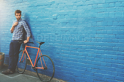 Buy stock photo Travel, thinking and businessman with bicycle in city for job, opportunity or morning commute on wall background. Carbon neutral, journey and cycling pause in London with eco friendly transportation