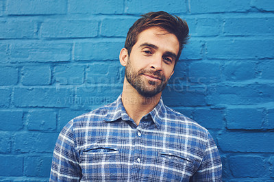 Buy stock photo Man, confident in portrait and relax on wall background, casual fashion and positivity with blue aesthetic. Cool smirk, pride and model in checkered shirt, style and lumberjack outfit in Australia