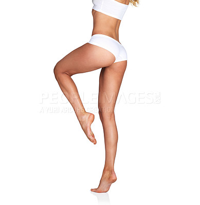 Buy stock photo Woman, legs and skincare with mockup in studio for grooming, smooth and soft perfection on white background. Feet, leg and girl model relax in underwear for skin, glow or luxury wellness and isolated