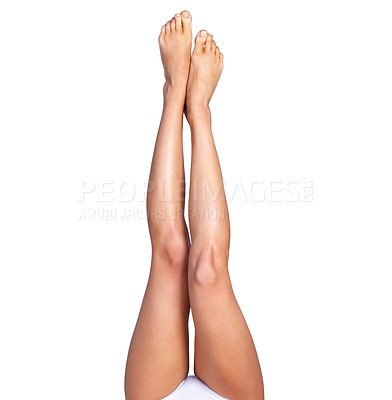 Buy stock photo Skincare, legs and above a woman on mockup in studio for grooming, smooth and soft on white background. Feet, leg and girl model relax for treatment, skin and glow, luxury and wellness while isolated