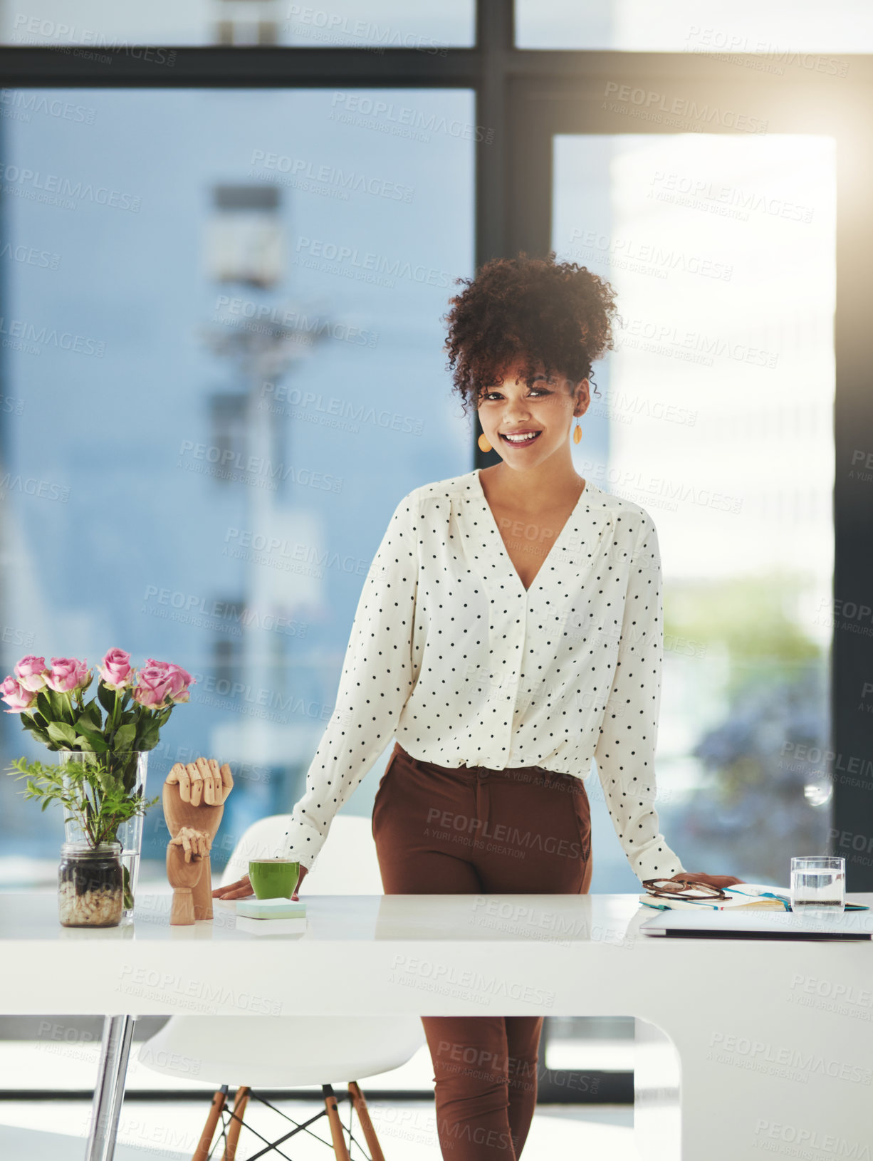 Buy stock photo Shot of a beautiful young businesswoman working in her office 