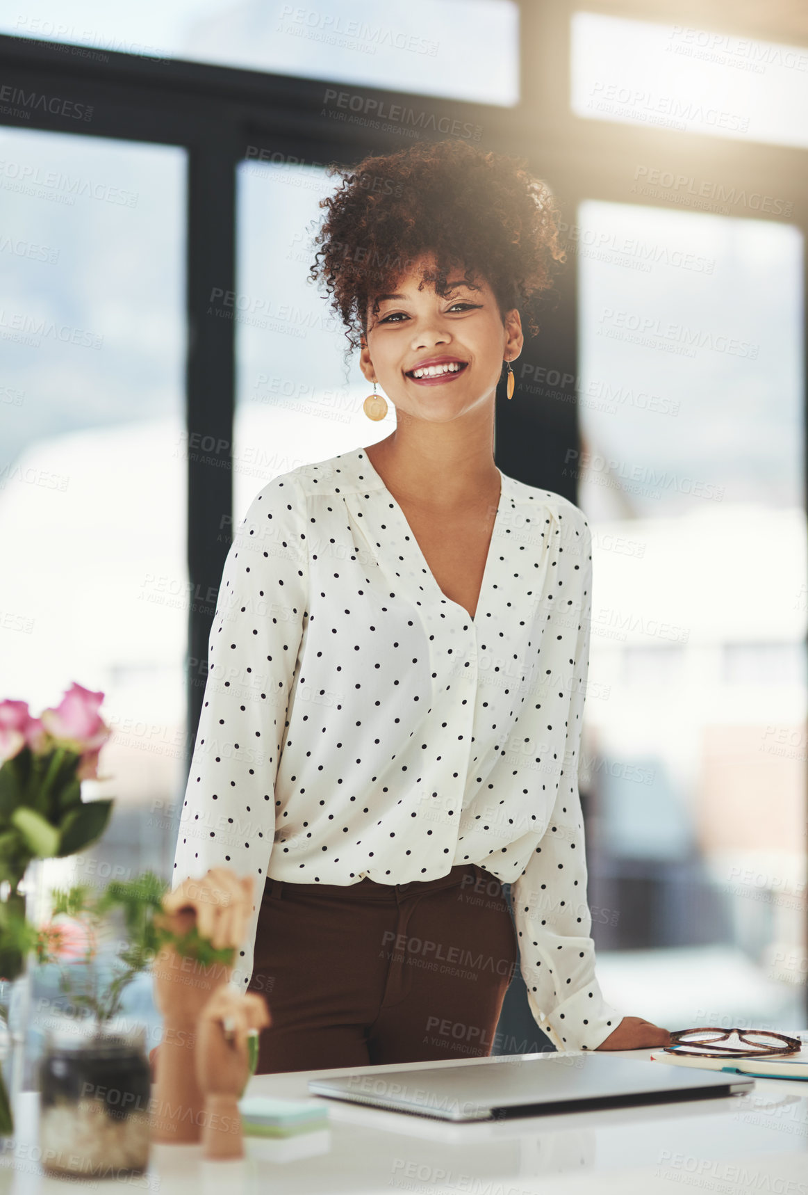 Buy stock photo Shot of a beautiful young businesswoman working in her office 