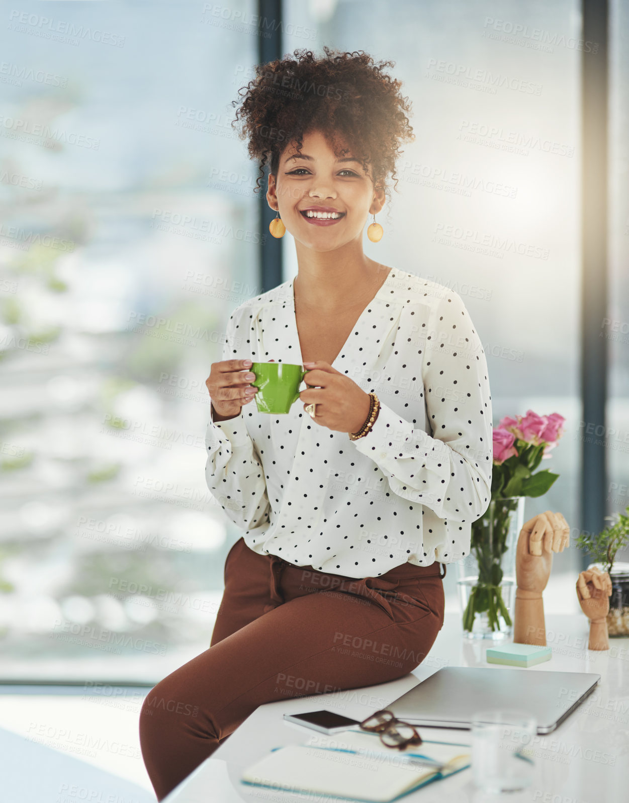 Buy stock photo Shot of a beautiful young businesswoman working in her office 