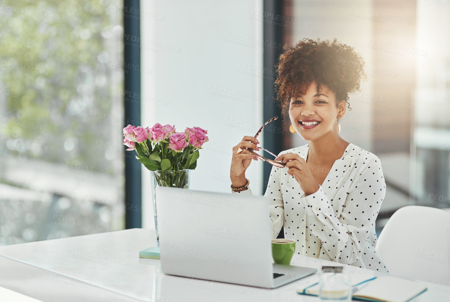 Buy stock photo Shot of a beautiful young businesswoman working in her office 