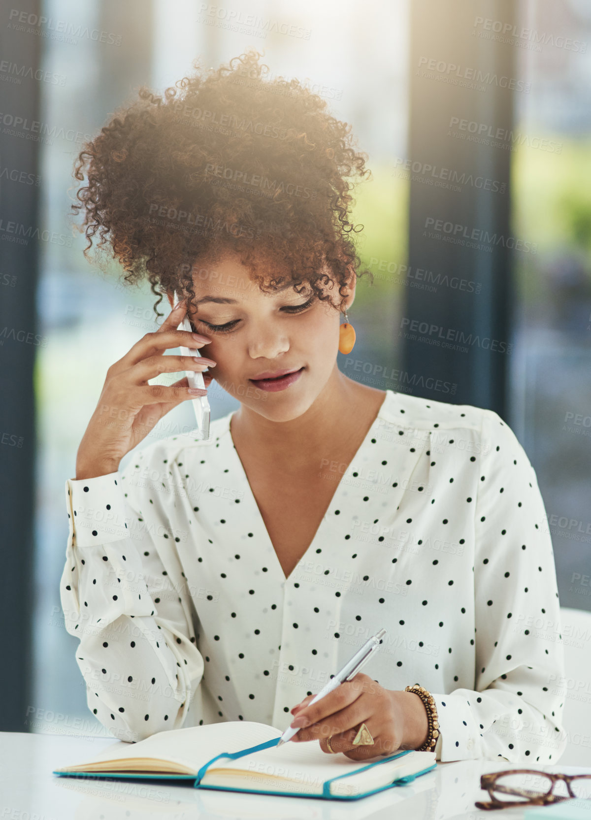 Buy stock photo Shot of a beautiful young businesswoman working in her office 