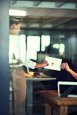 Buy stock photo Shot of a unrecognizable businessperson excepting a letter that's been given to her in the office