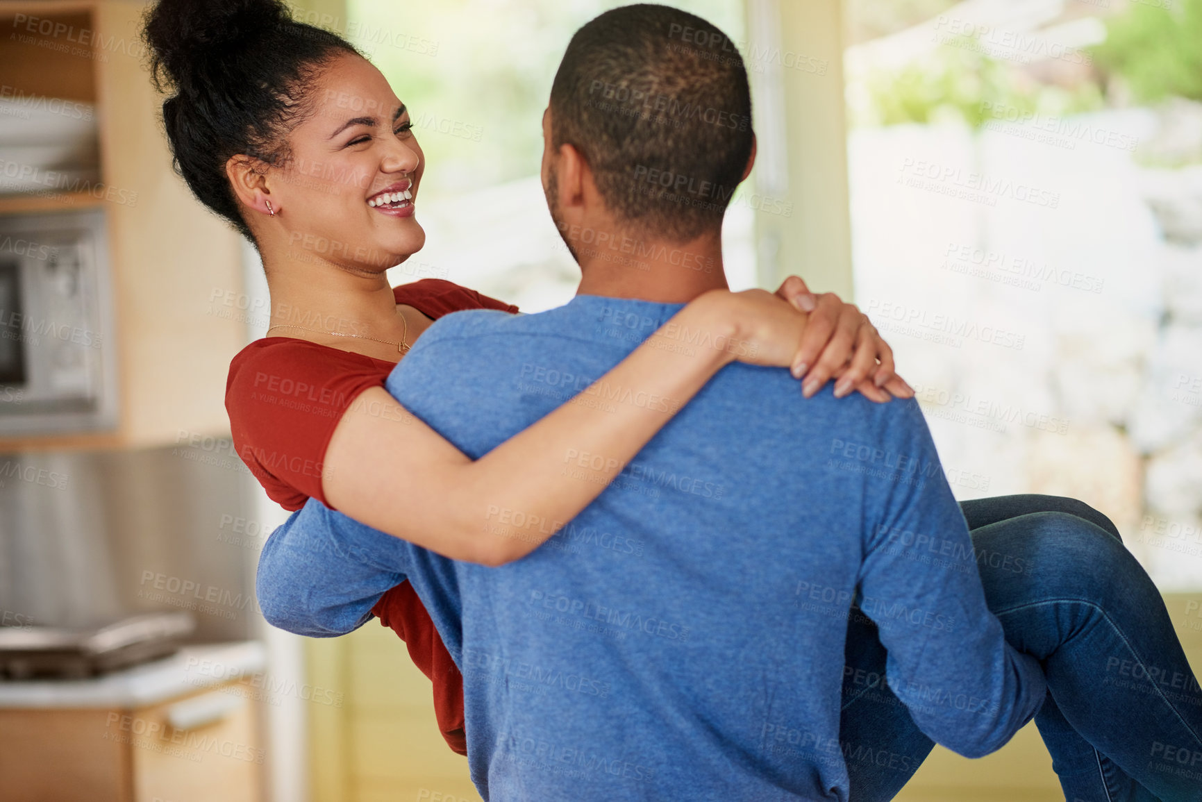 Buy stock photo Carry, laughing and love with couple in kitchen of home together for bonding, relationship or romance. Date, happy or smile with silly man and woman having fun in apartment for comedy or humor