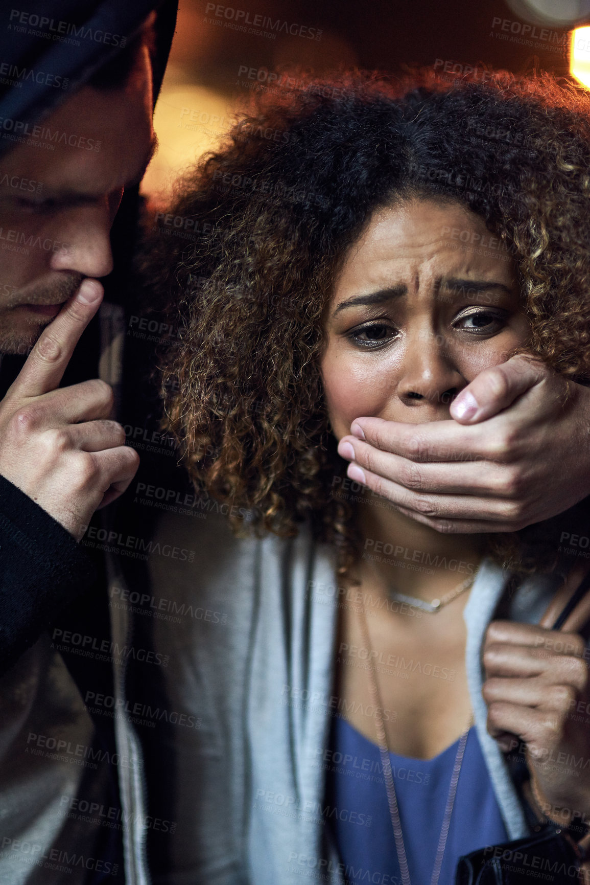 Buy stock photo Cropped shot of a defenceless young woman being robbed by a thief