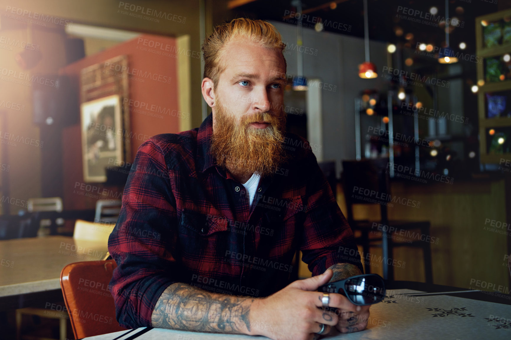 Buy stock photo Cropped shot of a male hipster in a coffee shop