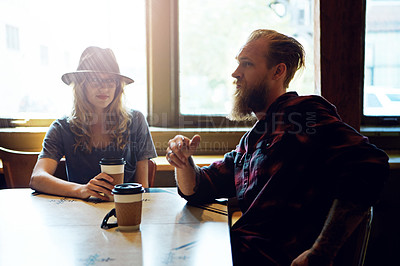 Buy stock photo Cropped shot of a hipster couple in a coffee shop