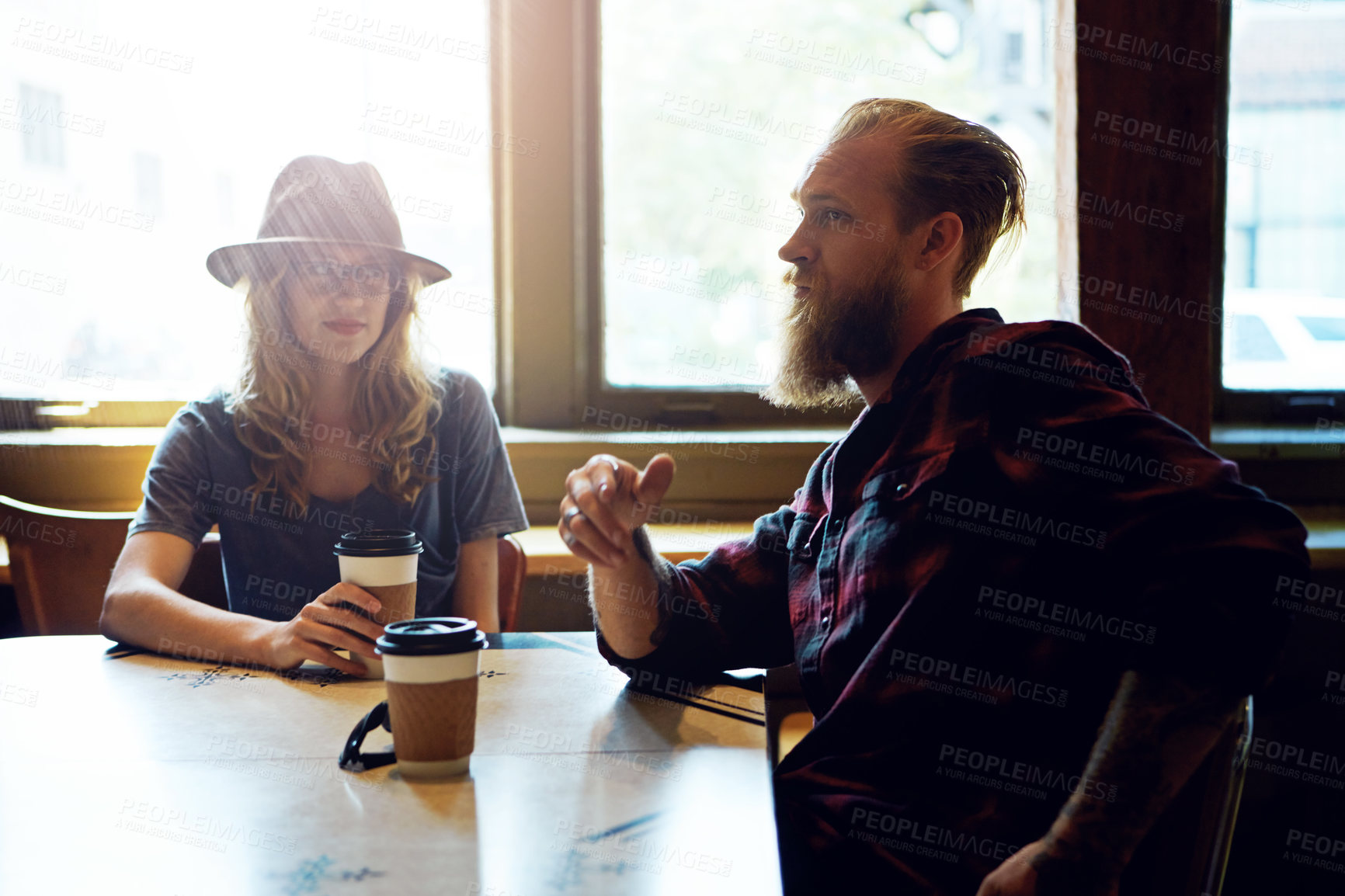 Buy stock photo Cropped shot of a hipster couple in a coffee shop