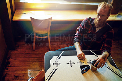 Buy stock photo Cropped shot of a male hipster in a coffee shop