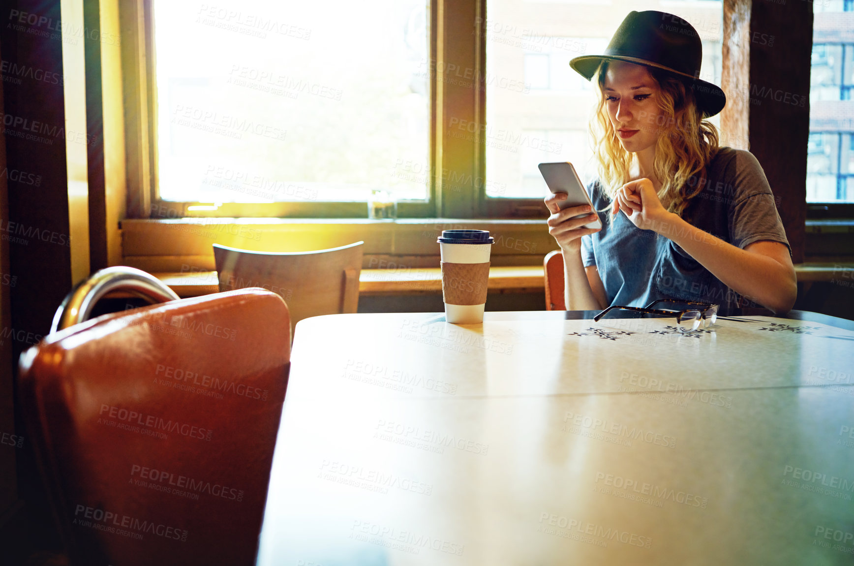 Buy stock photo Cropped shot of a female hipster in a coffee shop