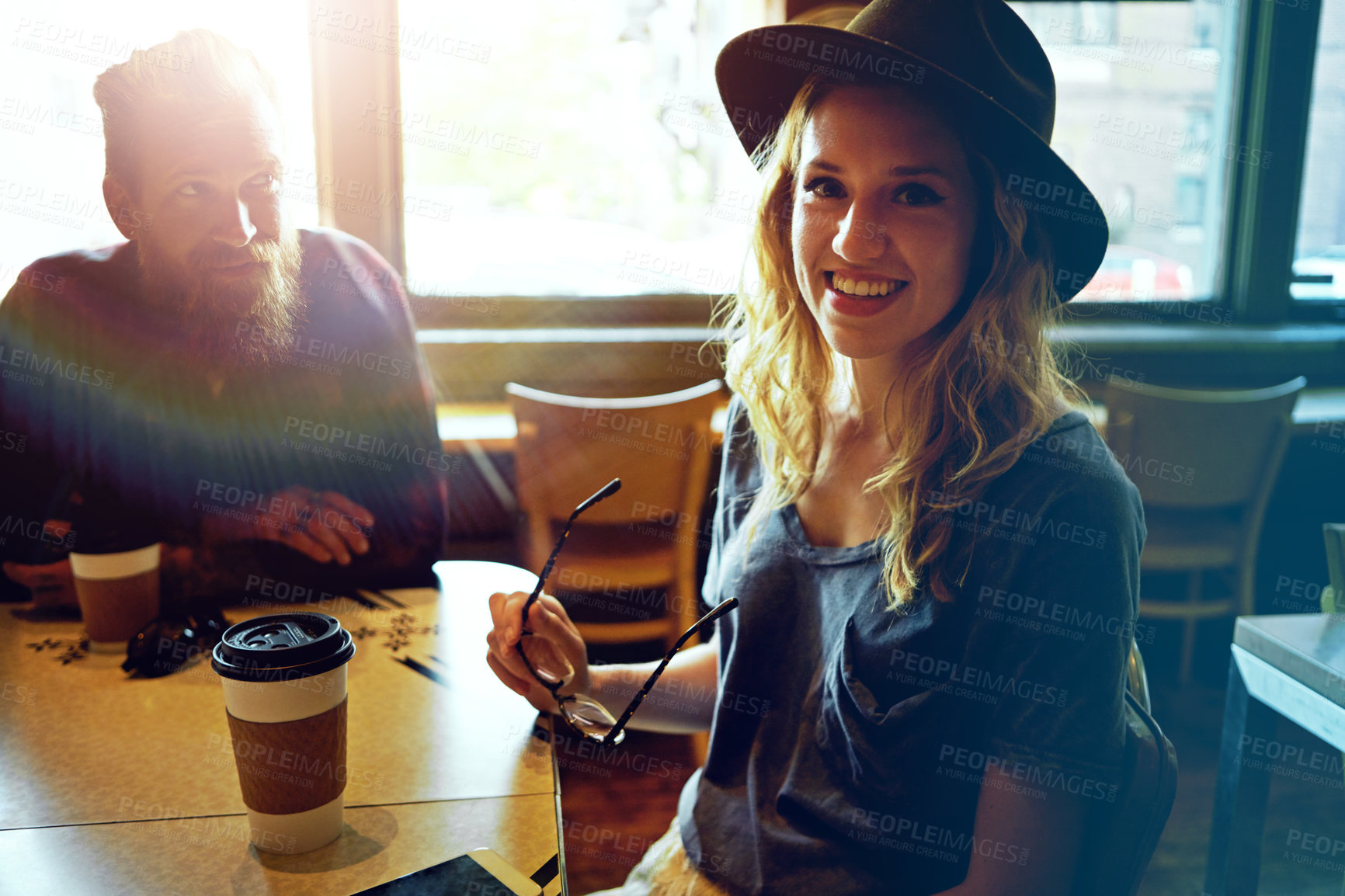 Buy stock photo Cropped shot of a hipster couple in a coffee shop