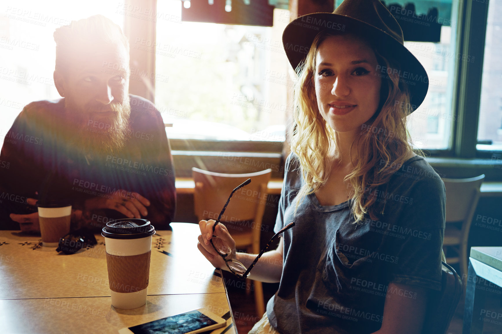 Buy stock photo Cropped shot of a hipster couple in a coffee shop