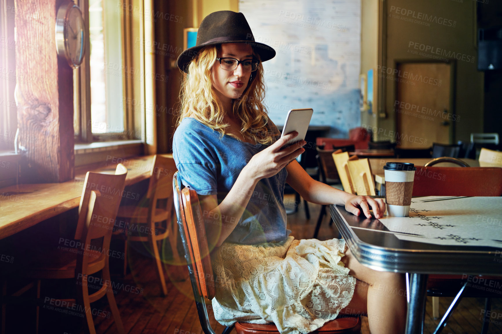 Buy stock photo Cropped shot of a female hipster in a coffee shop