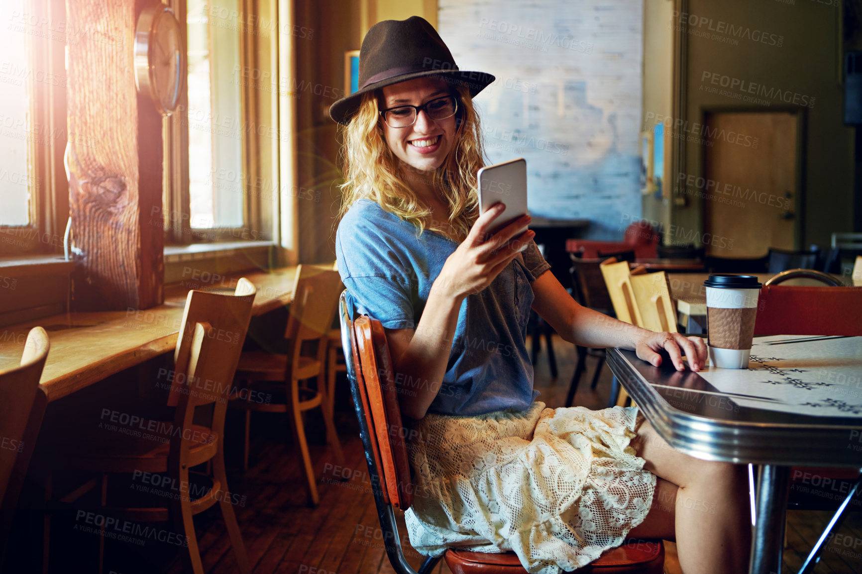 Buy stock photo Cropped shot of a female hipster in a coffee shop