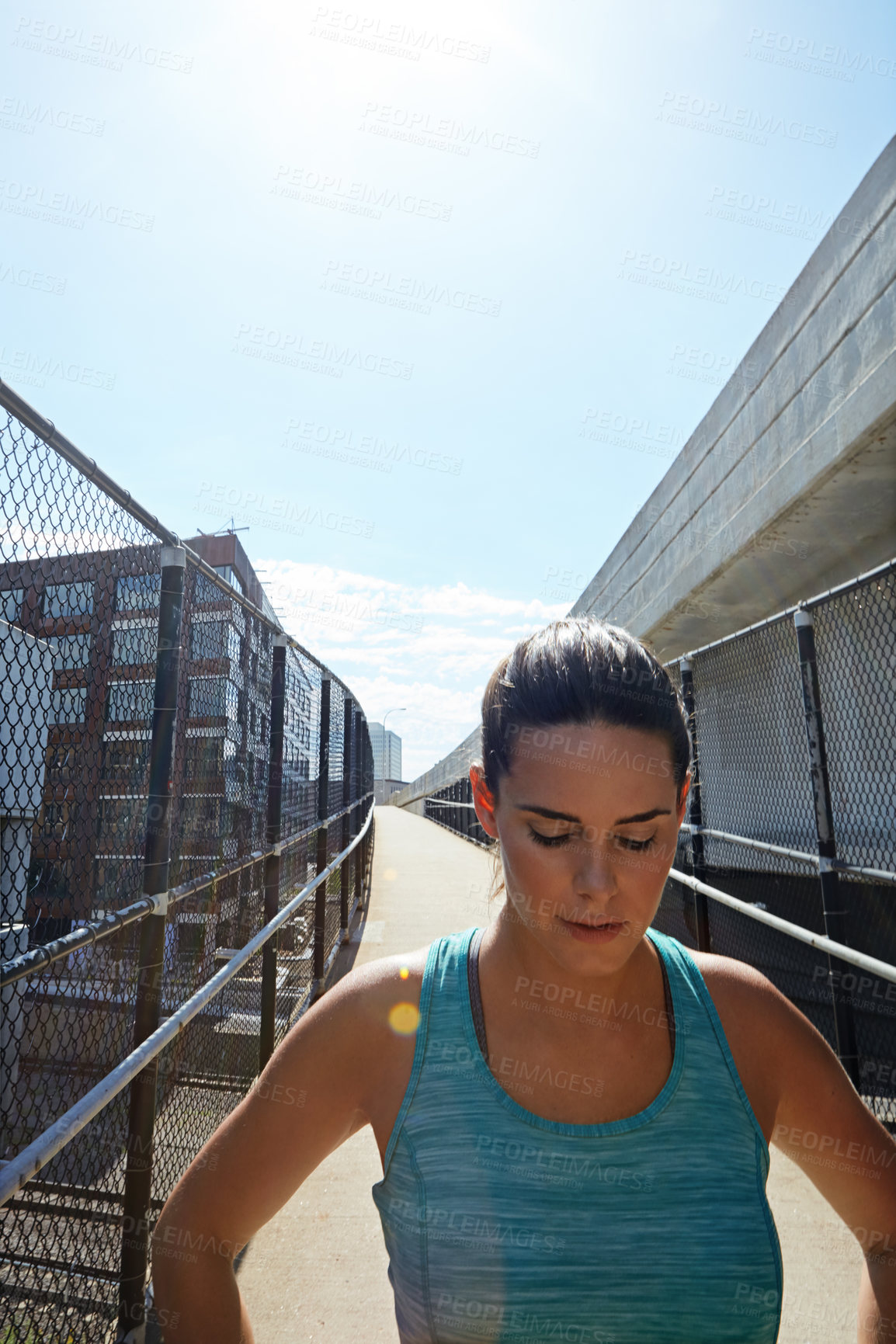 Buy stock photo Fitness, woman and walking outdoor on bridge with running break, workout pause and breathe for recovery. Space, female person and runner in city with cardio exercise rest, contemplation and wellness.