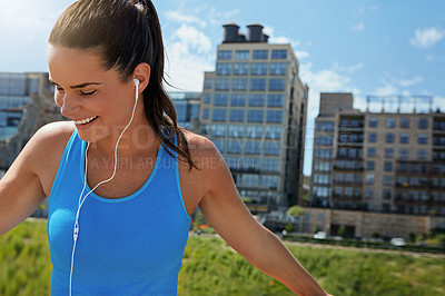 Buy stock photo Shot of an attractive young female runner exercising outdoors