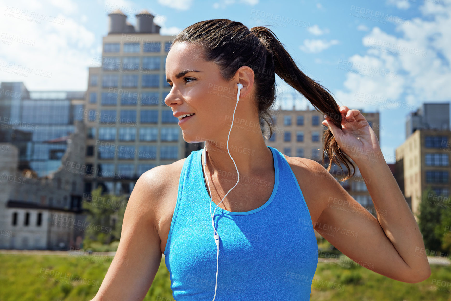 Buy stock photo Shot of an attractive young female runner exercising outdoors