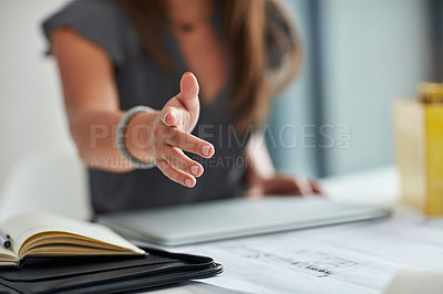 Buy stock photo Cropped shot of a businesswoman extending a handshake