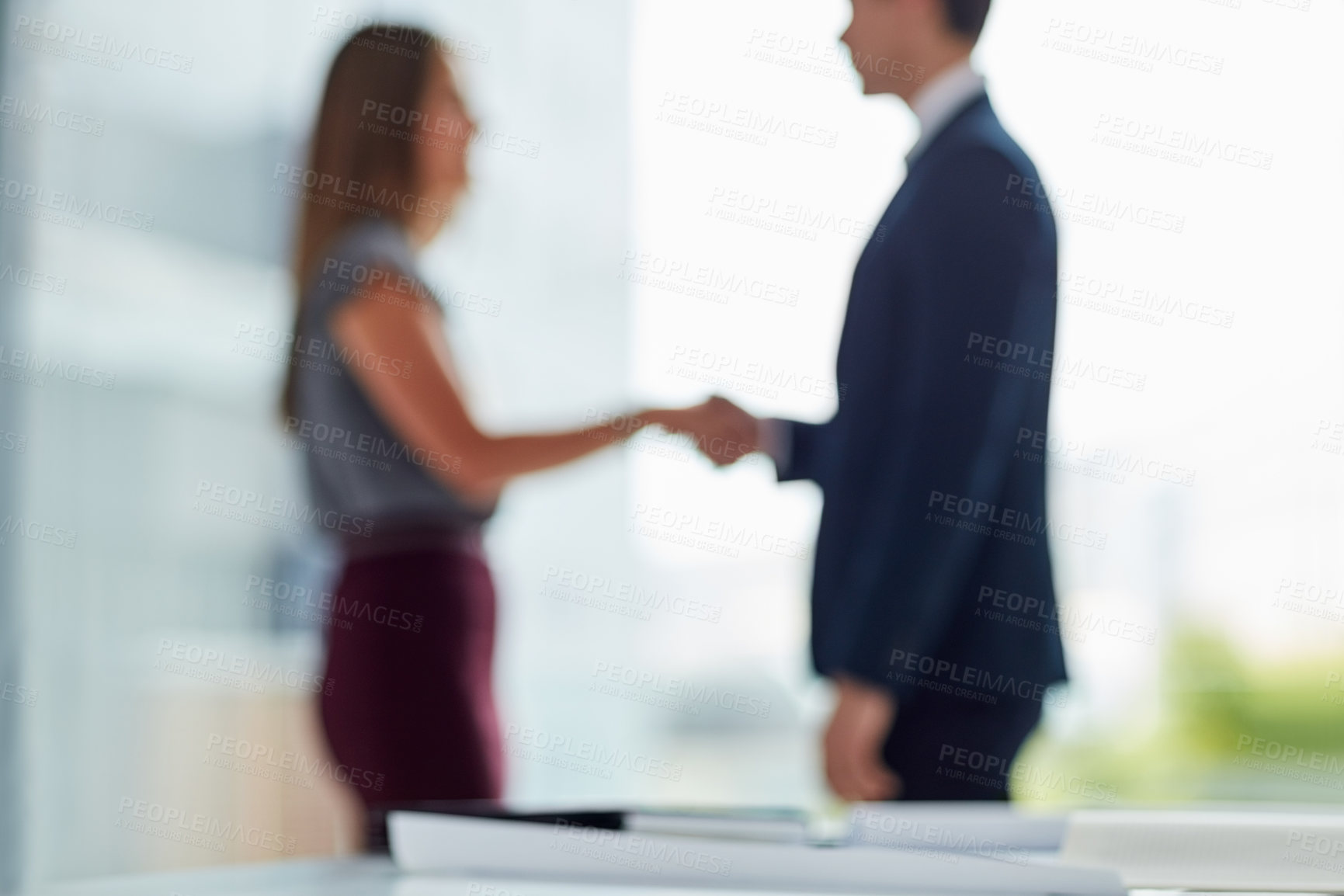 Buy stock photo Shaking hands, man and woman in blurred office for interview, welcome or onboarding for collaboration. Partnership, business people and handshake in conference room for agreement, consulting or deal.