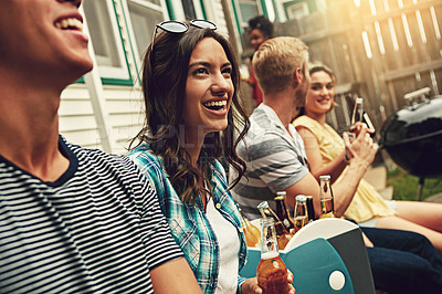 Buy stock photo Shot of a group of friends enjoying a party outdoors