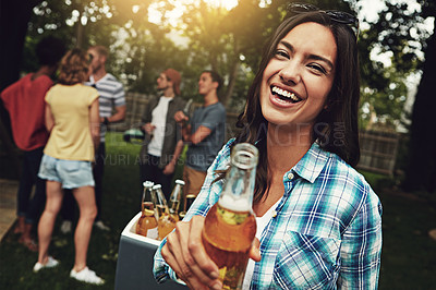 Buy stock photo Portrait of a young woman enjoying a party with friends outdoors