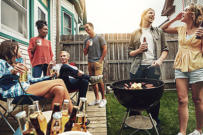 Buy stock photo Shot of a group of friends having a barbecue in the yard