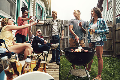 Buy stock photo Shot of a group of friends having a barbecue in the yard