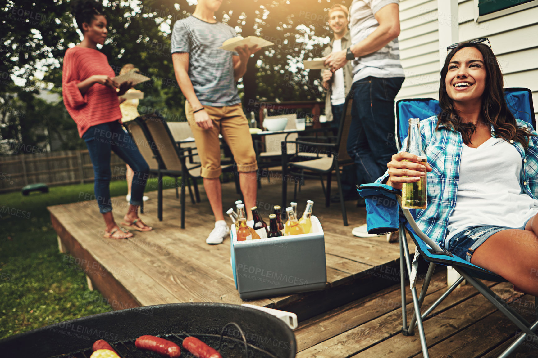 Buy stock photo Outdoor, gathering and barbecue for woman, group and break for reunion in weekend and party in home. People, men and friends with food to enjoy, meat and person cooking with grill, fun and dinner