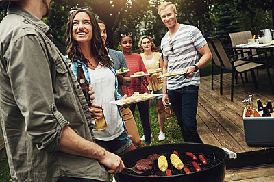 Buy stock photo Friends, barbecue and help for dishing with plate in backyard with diversity, cooking or meat on fire. People, men and women with beer, drink and relax for food by bbq grill on holiday in Australia