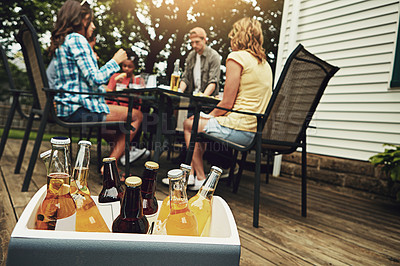 Buy stock photo Friends, people and drinks at barbecue in backyard, summer and vacation for holiday, celebration or event. Group, cheerful and bbq with cooler box for dinner, party or reunion with alcohol in America