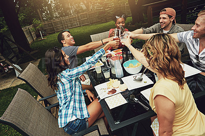 Buy stock photo Friends, toast and lunch in summer, backyard or happy for food, diversity or celebration on patio. People, men and women with drink, alcohol or beer for cheers, success or excited at brunch in garden