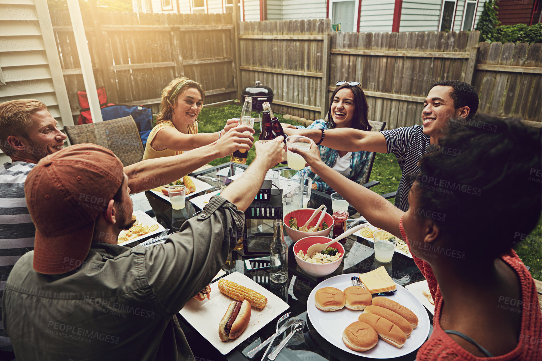 Buy stock photo People, toast and bbq at party, backyard or happy for food, diversity or celebration in summer. Friends, men and women with drink, alcohol and beer for cheers, success or excited at brunch in garden