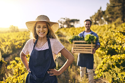Buy stock photo Shot of a young man and woman working together on a farm
