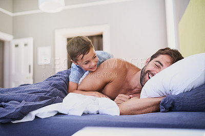 Buy stock photo Cropped shot of a handsome young man being woken up by his son